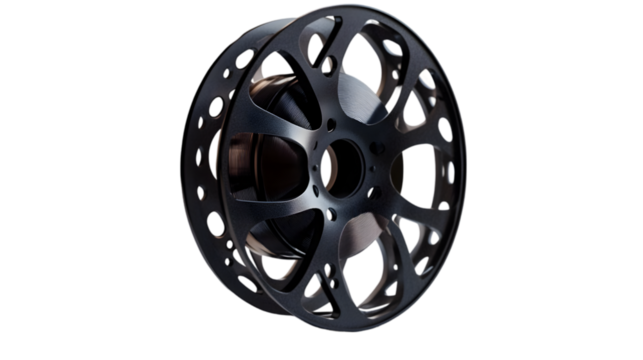 Intricate black metal wheel with circular openings and smooth finish