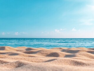Expansive sandy beach during a clear day with a calm ocean in the distance