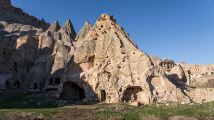 Ancient cave dwellings carved in rock - majestic eroded fairy chimneys at Selime, Aksaray province, Turkey