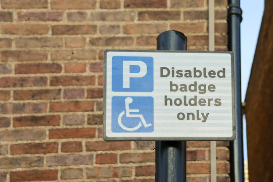 Disabled badge holders only sign parking