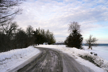 Icy country road near the shore of Lake Ontario on a mid-winter afternoon