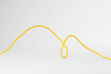 One yellow electrical wire isolated on white