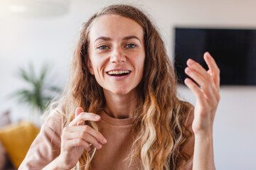 Happy young woman blogger applicant teacher during video chat