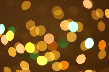 Blurred view of colorful lights on color background, bokeh effect