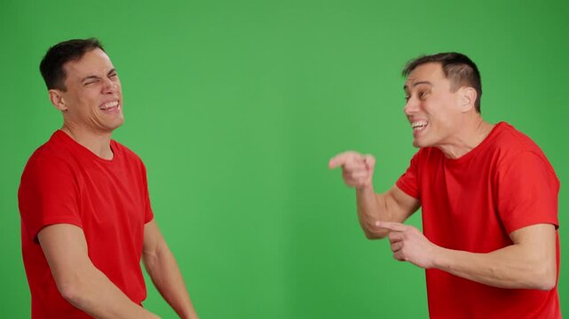 Man arguing with himself on green screen