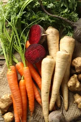  Different root vegetables on wooden table, flat lay © New Africa