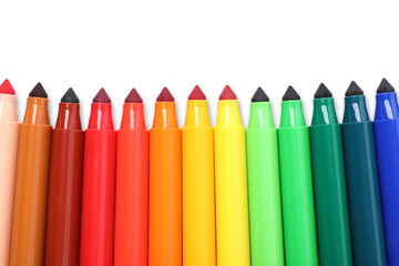 Many colorful markers isolated on white, top view