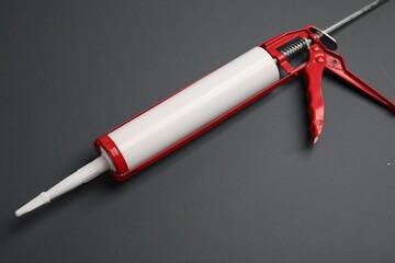 One glue gun on gray background, above view