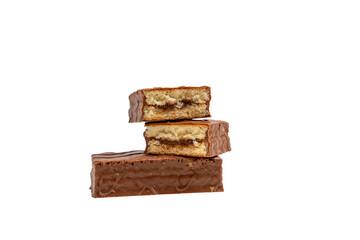 chocolate cake isolated on white background. Chocolate cake, and on top of it lies another chocolate cake, cut in half.