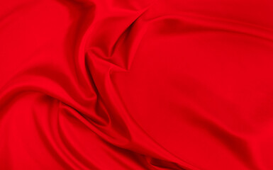 Black red satin dark fabric texture luxurious shiny that is abstract silk cloth background with patterns soft waves blur beautiful.