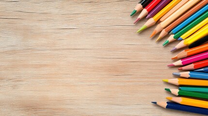 Obraz premium Vibrant Colored Pencils Arranged on Light Wooden Background