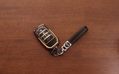 car keys on wooden background.