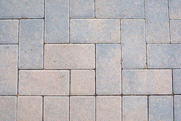 grey and tan stone brick walkway texture background