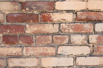 tan and red brick wall texture background close up horizontal