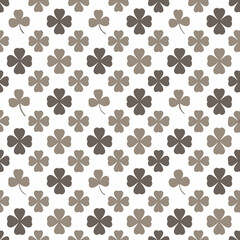 Fototapeta premium A seamless collection of shamrock-patterned tiles, including variations with different densities and color tones, isolated on a white background. 