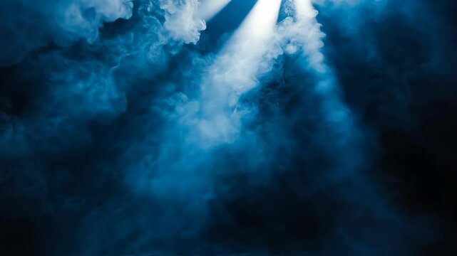 Mysterious blue fog illuminated by beams of light creates an ethereal atmosphere