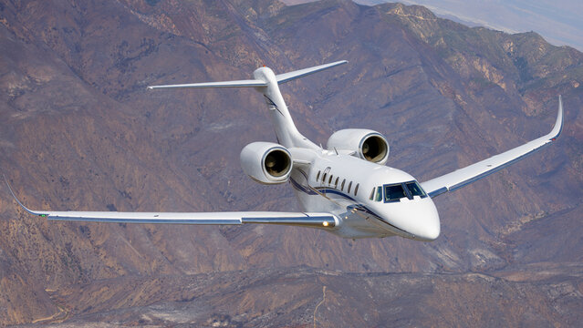 Frontal view of a  Citation X (business jet) over South California