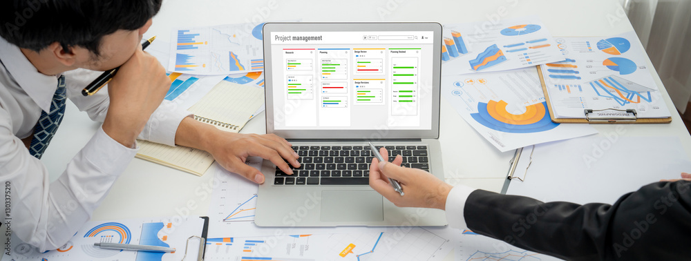 Poster project planning software for brisk business project management on the computer screen showing timel