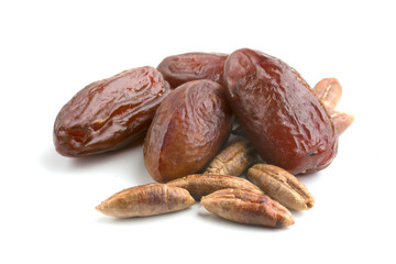dried dates with pits on white background