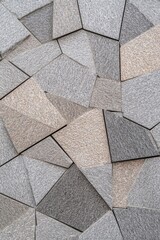 Geometric stone wall with unique shapes and patterns for background or design use