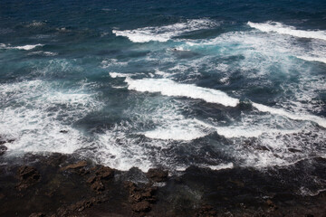 waves crashing on rocks
