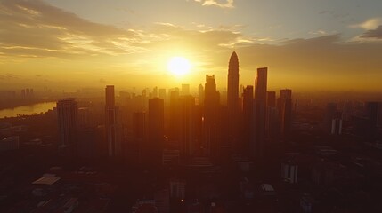 Stunning sunset over a vibrant city skyline, silhouetted against a golden sky.