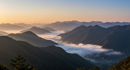 A dramatic dawn over a misty mountain range, revealing the untouched splendor of nature.