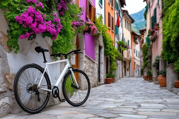 Charming street in an Italian village with colorful buildings, flowers, and a bicycle leaning against the wall