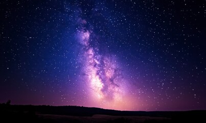 Beautiful night sky with the Milky Way and stars over a purple horizon, panoramic view
