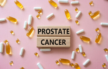 Prostate Cancer symbol. Concept word Prostate Cancer on wooden blocks. Beautiful pink background...