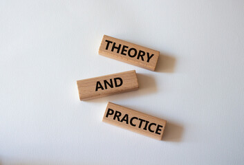 Theory and Practice symbol. Concept word Theory and Practice on wooden blocks. Beautiful white...