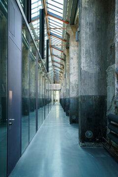 Long empty narrow corridor in university