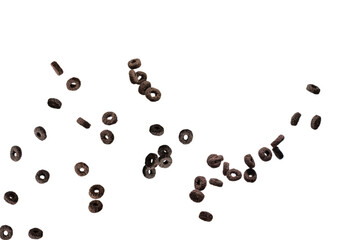 Chocolate rings cereal spill out into a bowl. Breakfast.