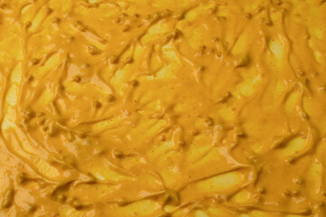 Yellow sauce splashes as a background.