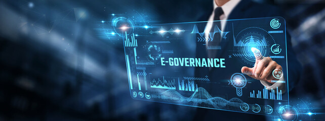 E-Governance: Businessman analyzing digital screen of graph data and policy implementation, digital...