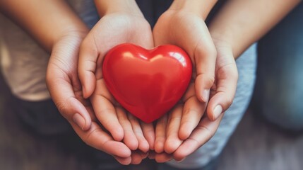 Family hands holding red heart, heart health insurance, charity volunteer donation, CSR responsibility, world heart day concept.