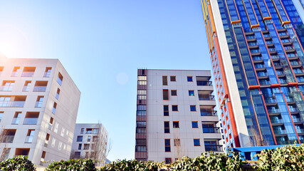Fototapeta premium Modern and new apartment building. Multistoried modern, new and stylish living block of flats.