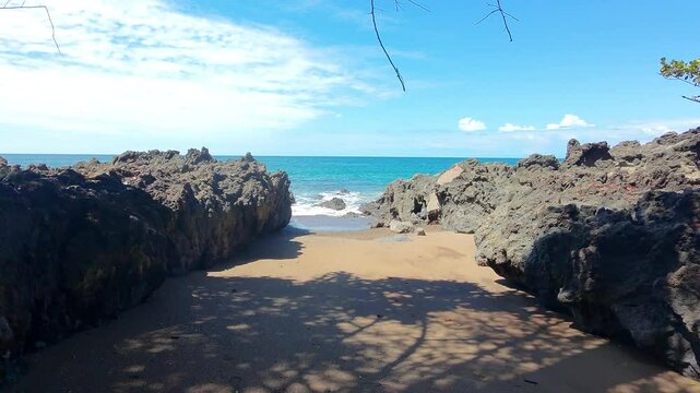 A drone shot of a beautiful cove beach on Drake's Bay Trail in Costa Rica