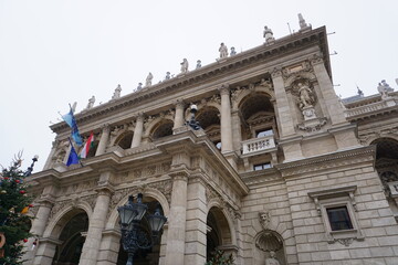Festive Christmas decoration outside the historic facade of the landmark Budapest Opera House in Budapest, Hungary in winter