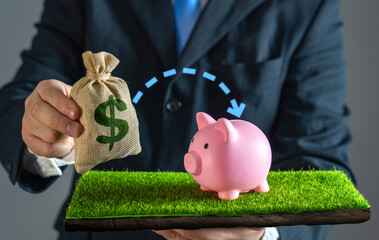 A businessman puts money into savings. Financial security and smart money management. Funds into a...