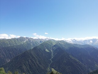 Mountain range under clear blue sky