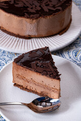 Piece of dark chocolate ice cream frozen cake on board