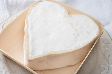 Cheese collection, French cheese from Normandy region, heart-shaped neufchatel from farm shop close up