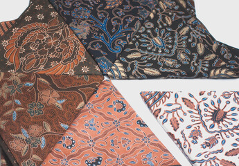 Several batik cloths arranged on a white background