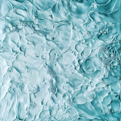 Water in motion creates an abstract design with bubbles and waves in a soothing blue-green color palette