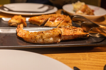 A close-up shot showcases a delectable shrimp dish, cooked to perfection and seasoned with aromatic spices, making it an irresistible culinary delight.