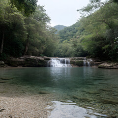 Fototapeta premium Tranquil waterfall cascading into a crystal-clear mountain pool