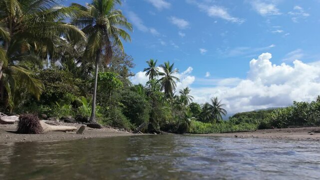 A small river flows on the Uvita beach in Costa Rica