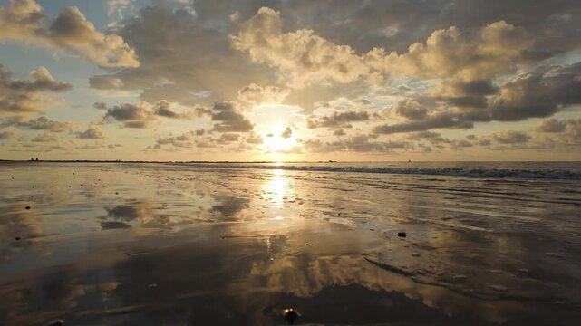 Golden sunset over a tranquil beach in Uvita, Costa Rica
