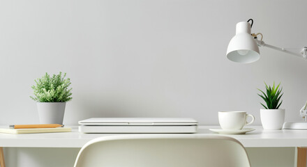 Modern Minimalist Workspace with White Desk, Laptop and Green Plants